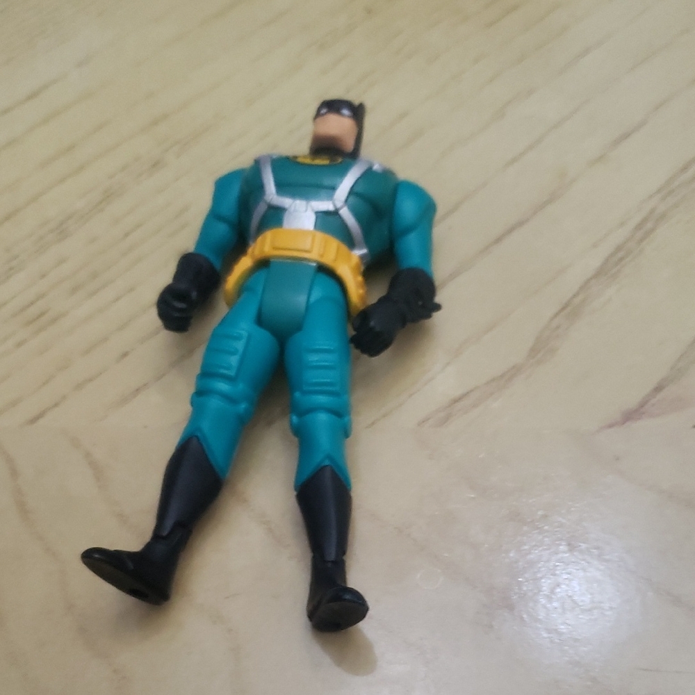 Action Figure in Teal and Black Suit Bat Man